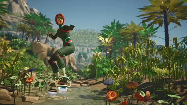 Hennessy in a green suit riding a hoverboard over a shallow stream lined with orange and blue flowers